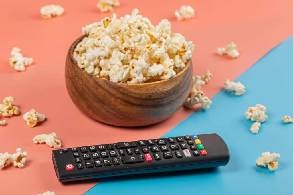 Photo of popcorn and a tv remote